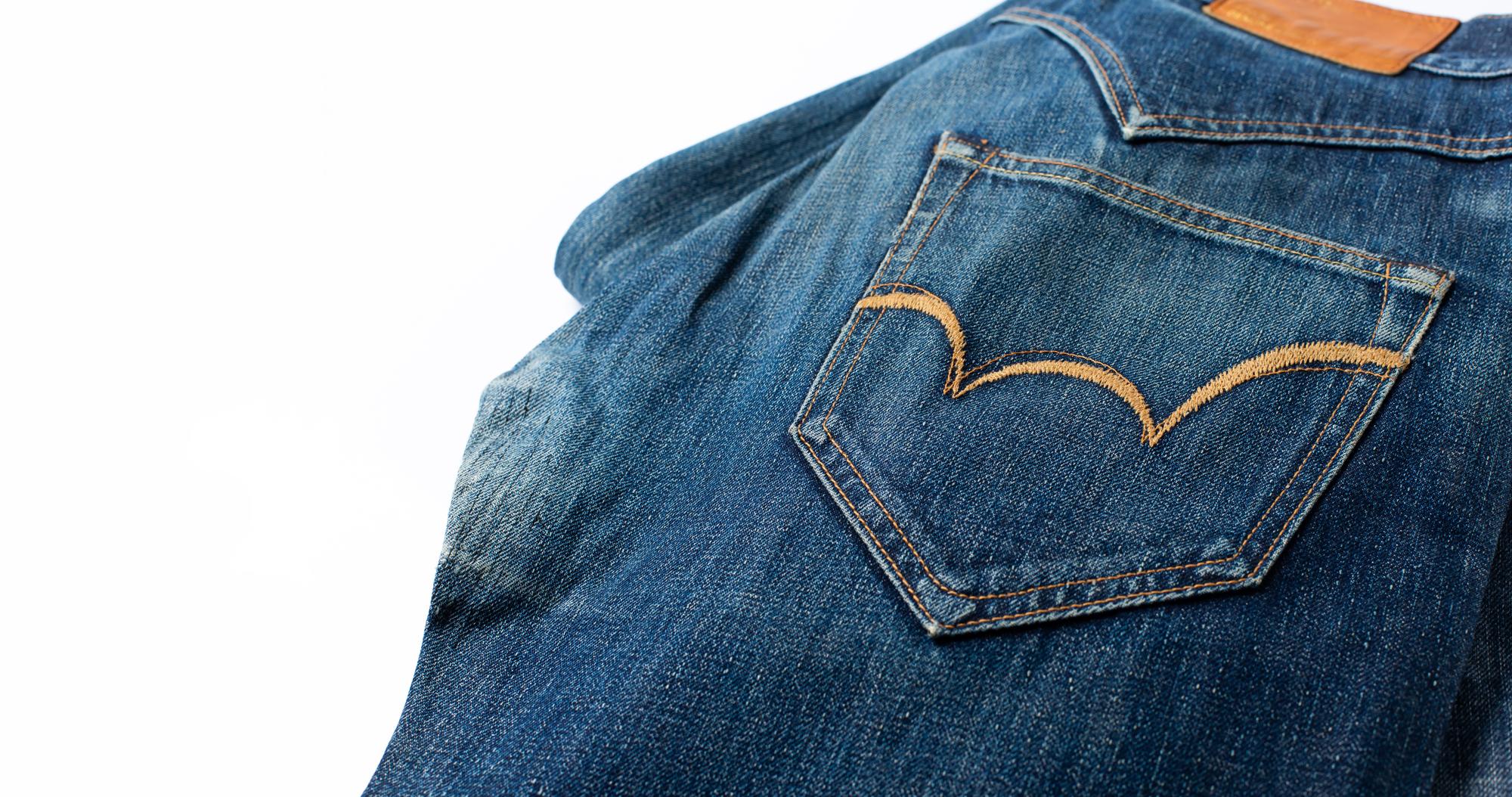 embroidered emblem on denim jacket, close-up